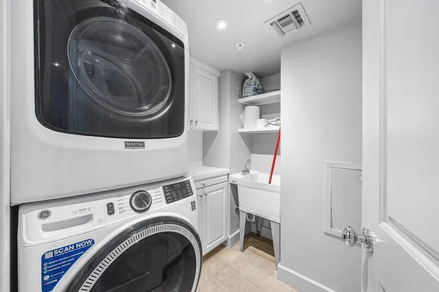 a large bathroom with a tub sink shower and a mirror
