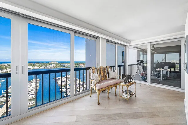 a dining room with furniture and a chandelier