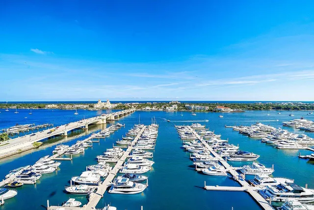 a living room with furniture and a view of kitchen