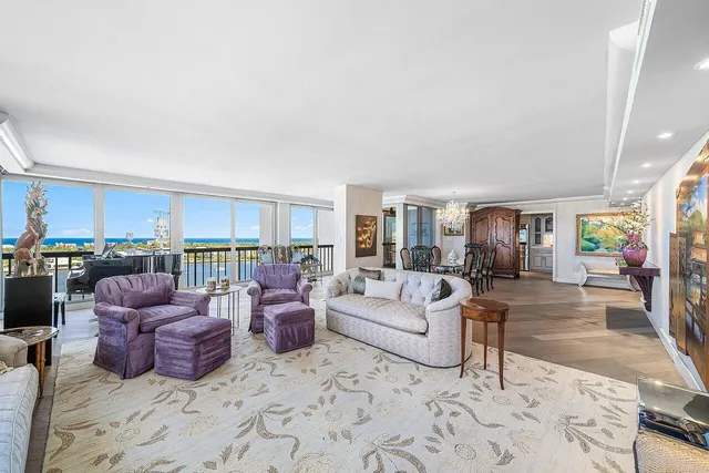 a living room with furniture floor and flat screen tv
