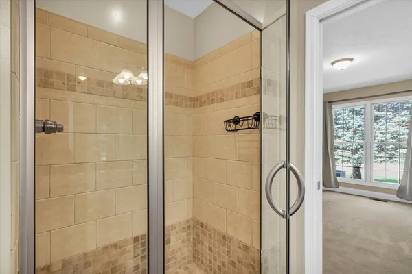 a bathroom with a shower and bathtub