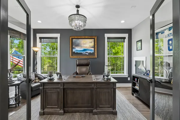 a living room with furniture and garden view