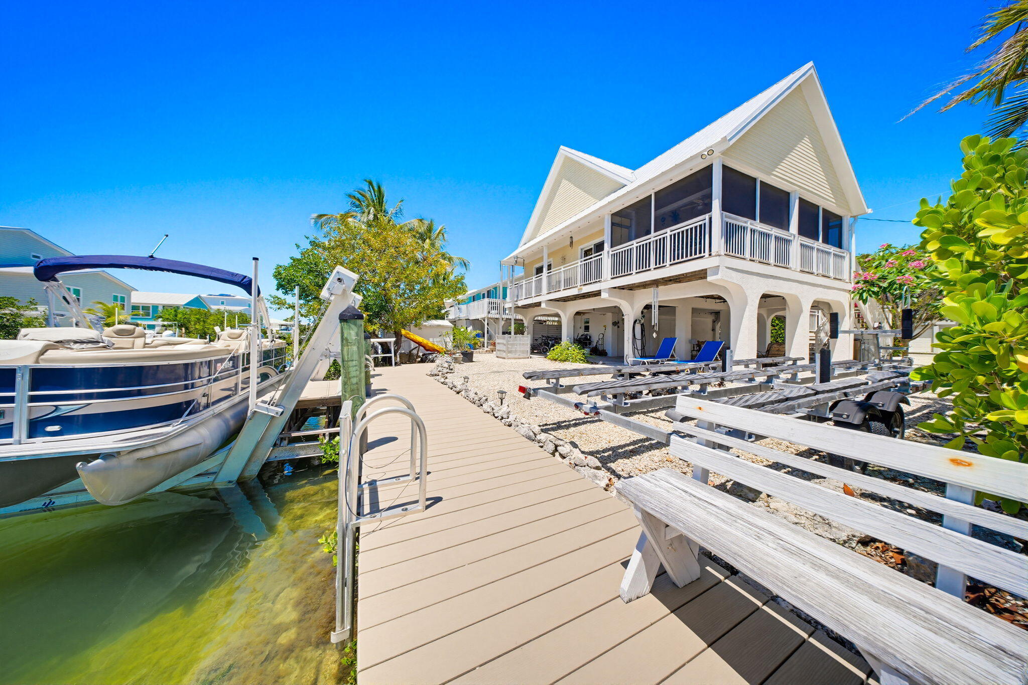 612 Blackbeard Road Summerland Key, FL 33042 - Photo 59 of 68 a view of a house with pool and chairs