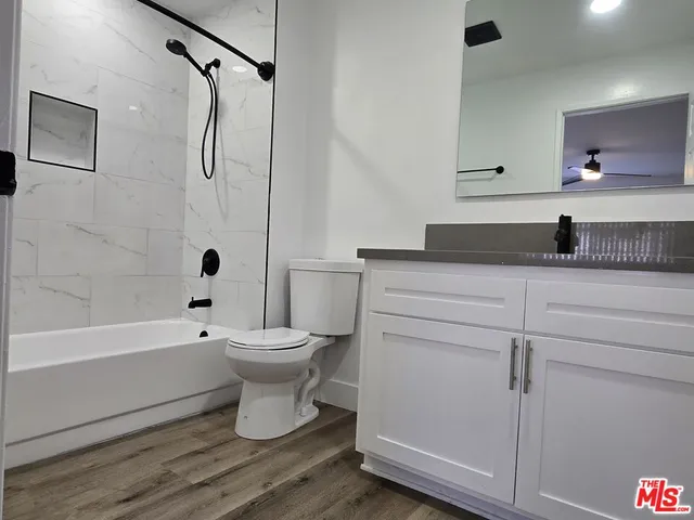 a bathroom with a sink toilet a shower and a bathtub