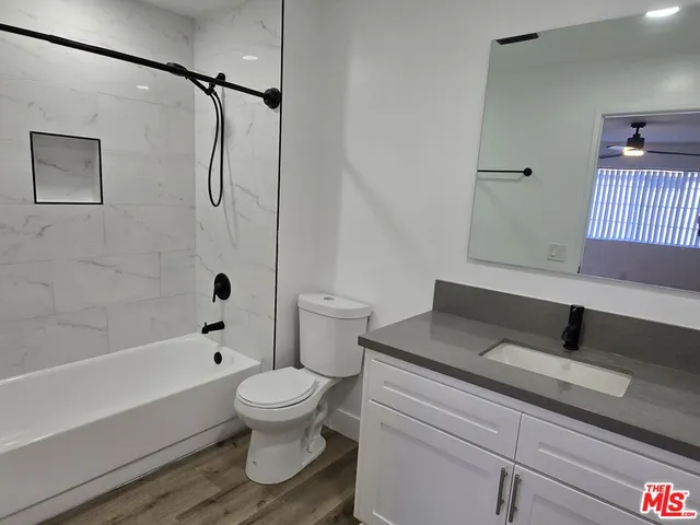 a bathroom with a toilet and a sink