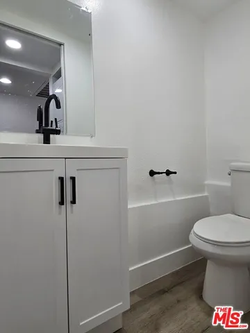 a bathroom with a toilet and a sink