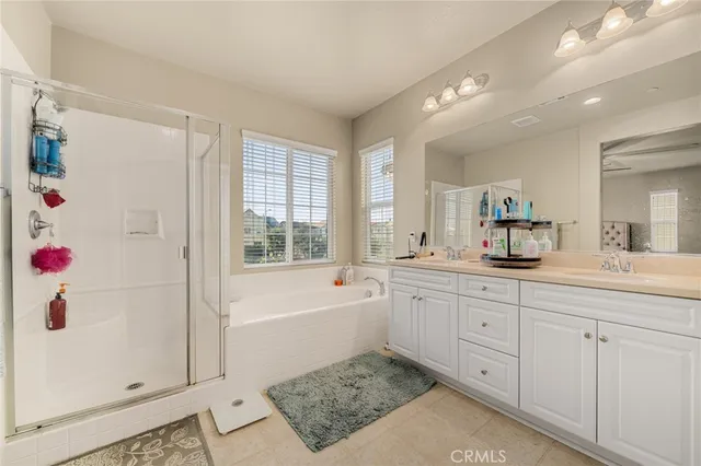 a bathroom with a tub sink and a mirror
