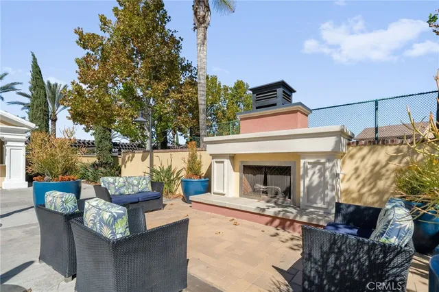 a view of living room with furniture and a fireplace