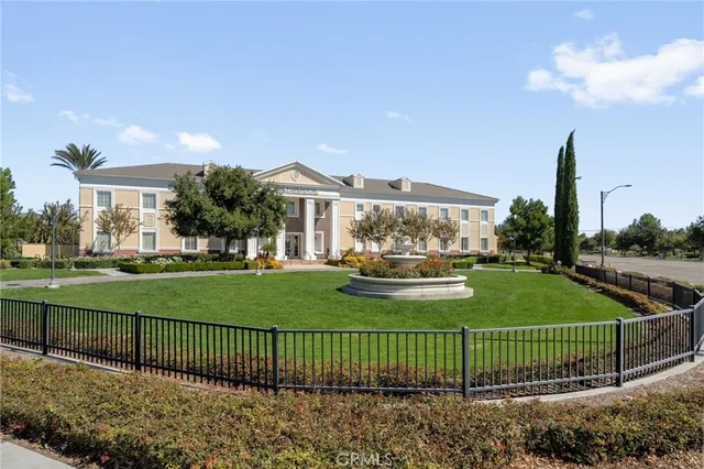 a view of a house with a yard and plants