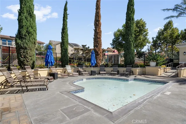 a view of a swimming pool with chairs