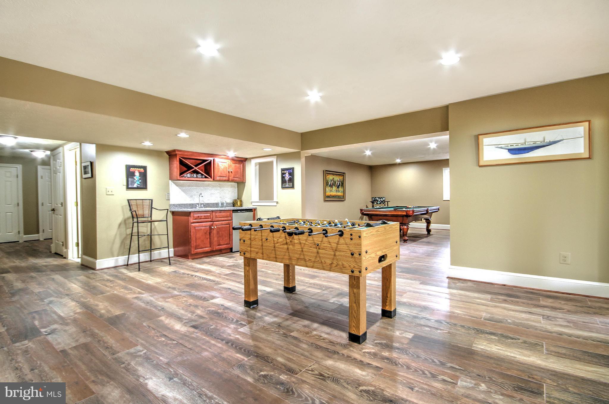 1207 Tottenham Court Reston, VA 20194 - Photo 4 of 30 Lower level game room, wet bar and billiard area