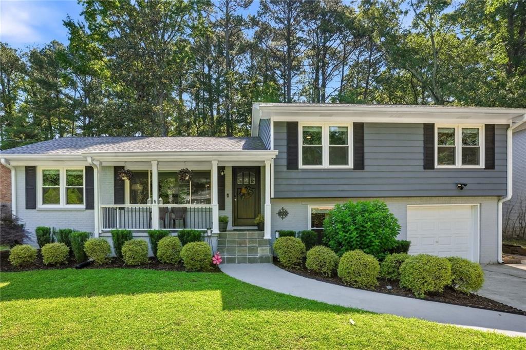 1430 Thomas Road Decatur, GA 30030 - Photo 1 of 42 a front view of a house with a yard