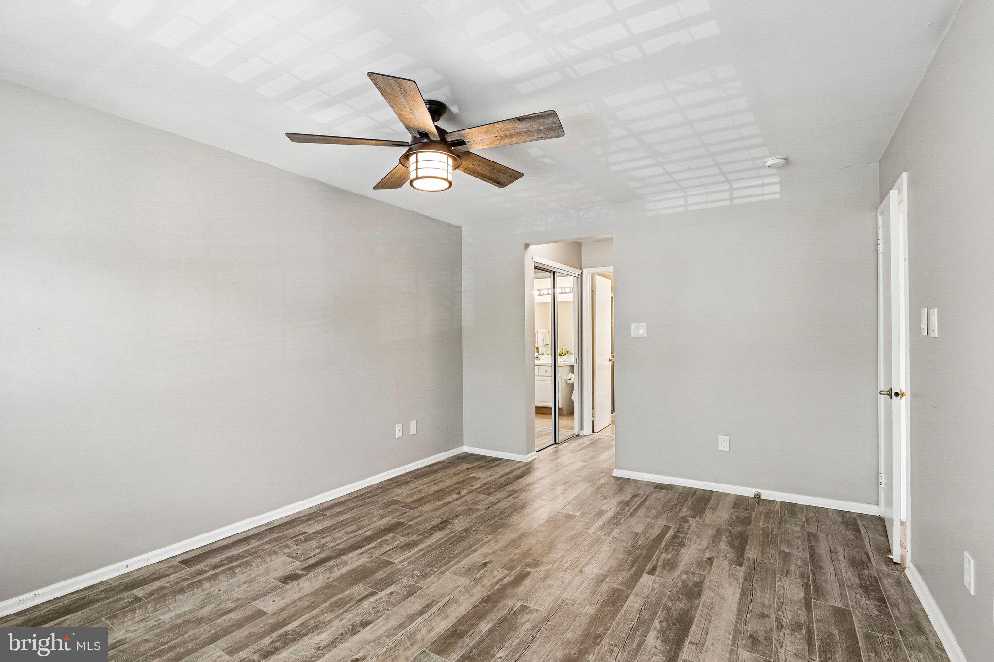 803 Wharton Road Mount Laurel, NJ 08054 - Photo 25 of 48 wooden floor in an empty room with a window