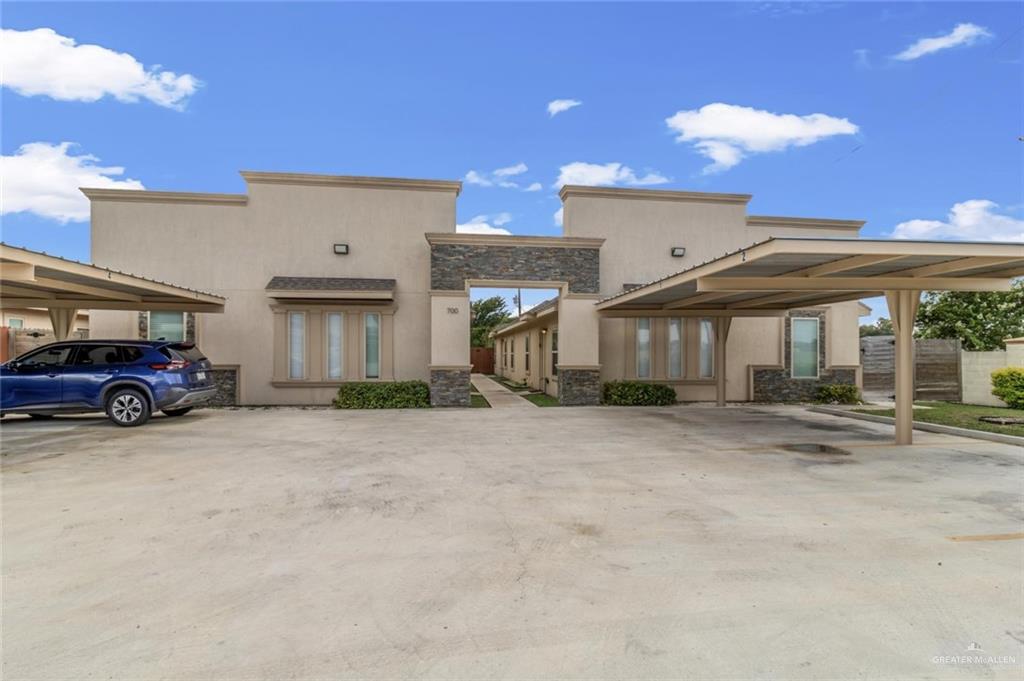 a view of a car park in front of house