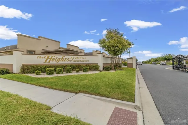 a view of a garden with a building in the background