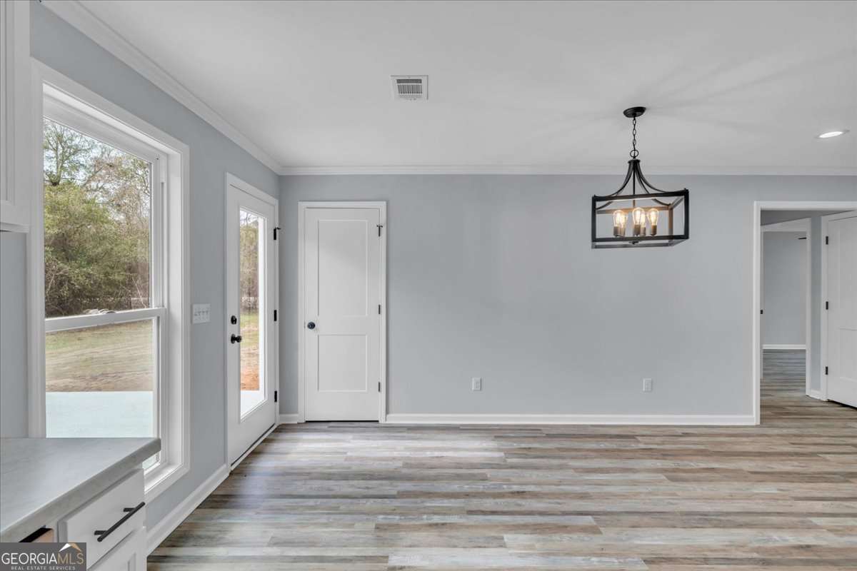 183 Bluegill Road Vienna, GA 31092 - Photo 20 of 67 a view of a livingroom with a hardwood floor ceiling fan and window