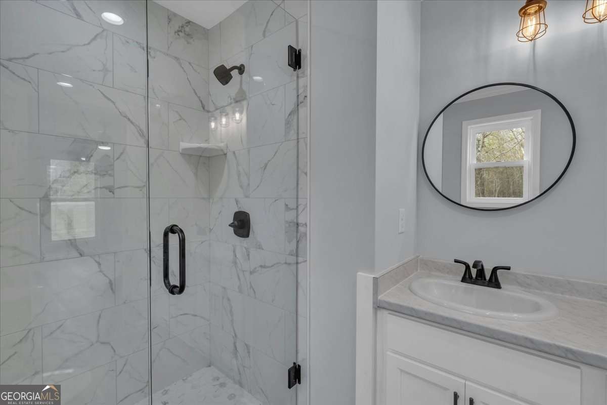 183 Bluegill Road Vienna, GA 31092 - Photo 27 of 67 a bathroom with a sink and a mirror
