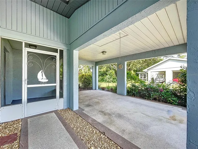 a view of a chairs and tables in a patio