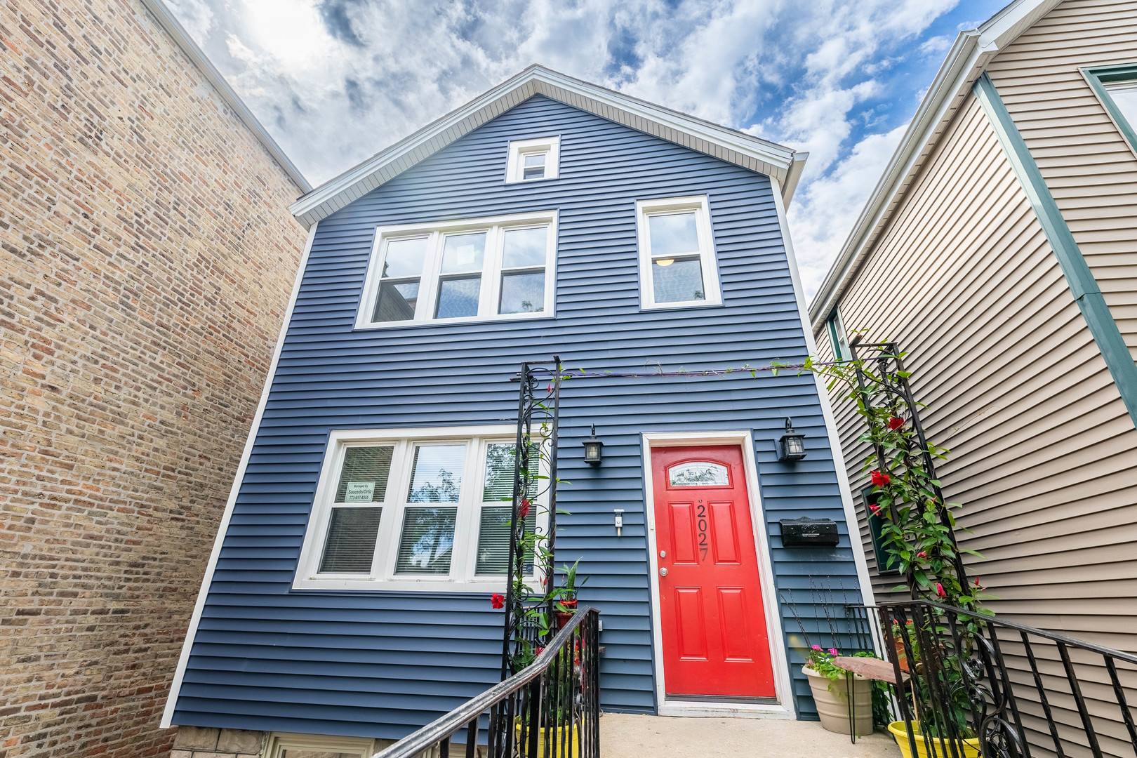 a view of a brick house with a small door