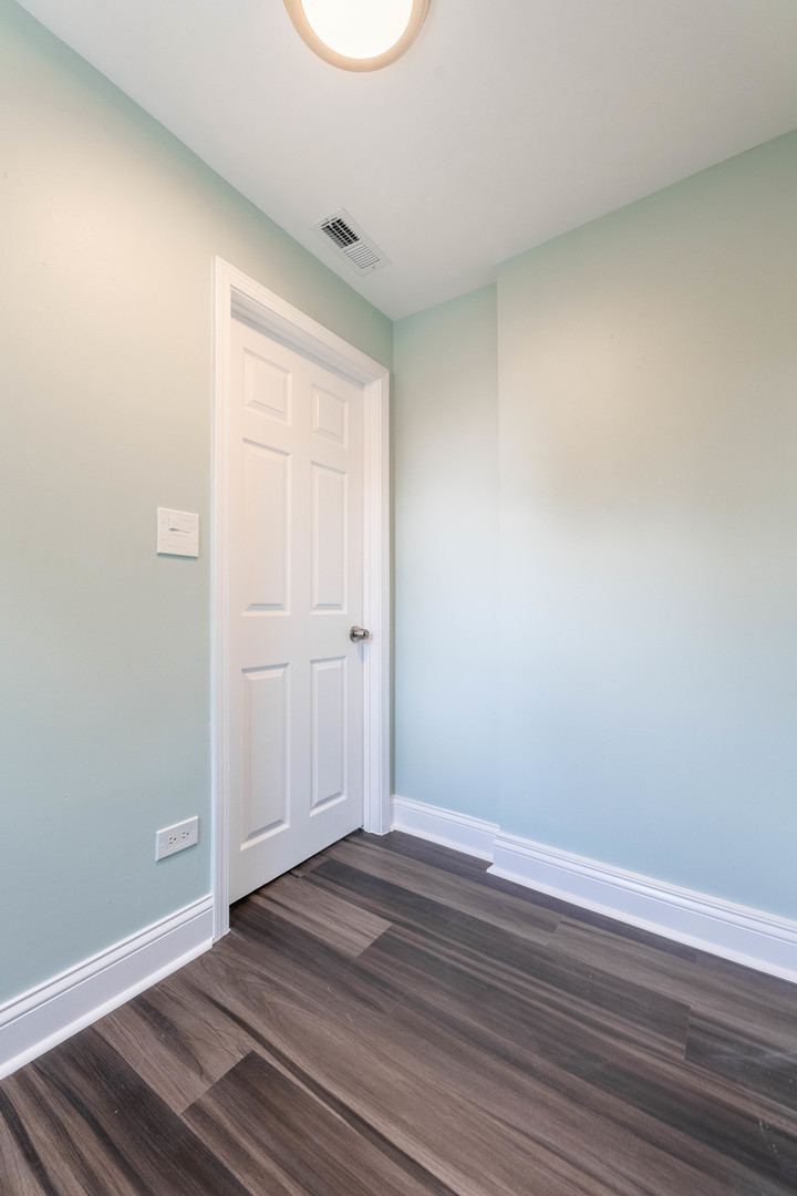 2027 West 18th Place, Unit 2 Chicago, IL 60608 - Photo 12 of 21 wooden floor in an empty room