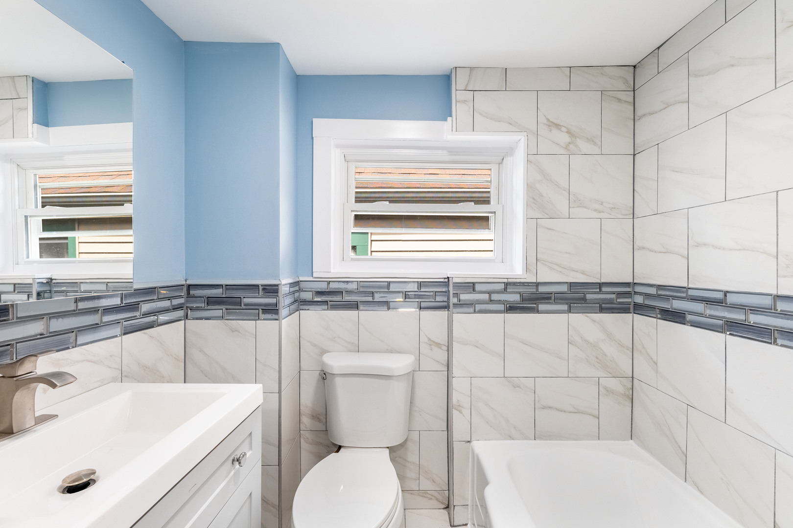 2027 West 18th Place, Unit 2 Chicago, IL 60608 - Photo 16 of 21 a bathroom with a sink a toilet and bathtub