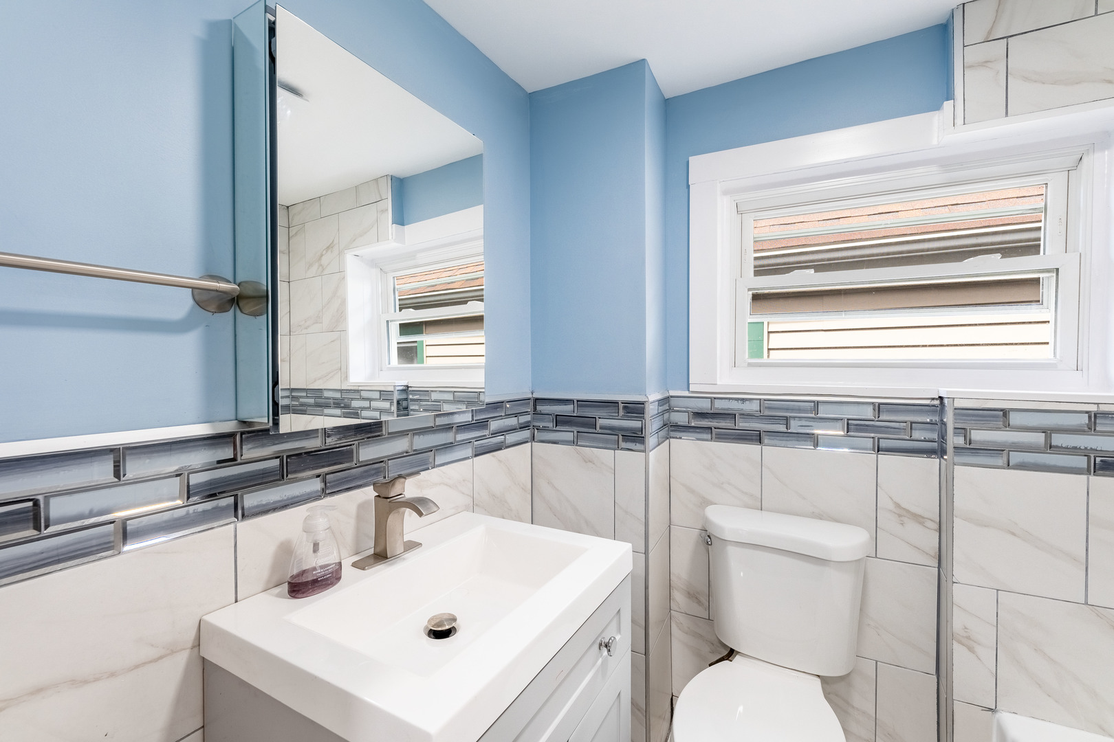 2027 West 18th Place, Unit 2 Chicago, IL 60608 - Photo 17 of 21 a bathroom with a sink a toilet and a bathtub