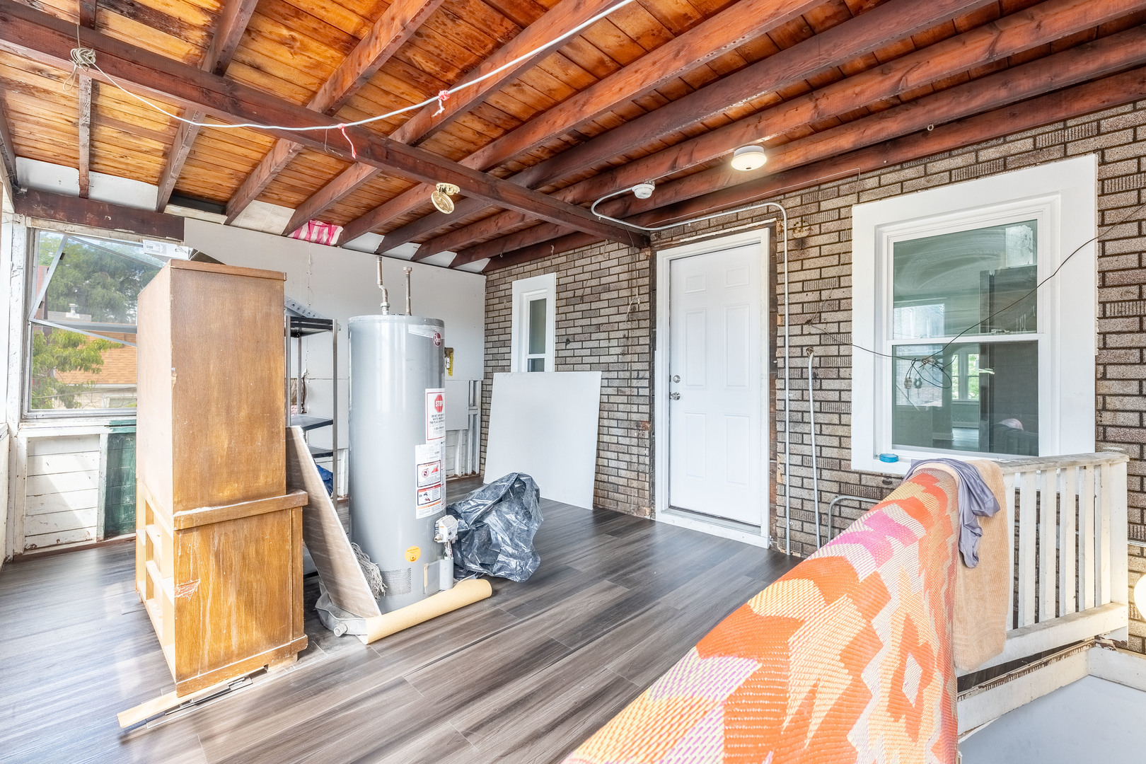 2027 West 18th Place, Unit 2 Chicago, IL 60608 - Photo 21 of 21 a view of a room with wooden floor and windows