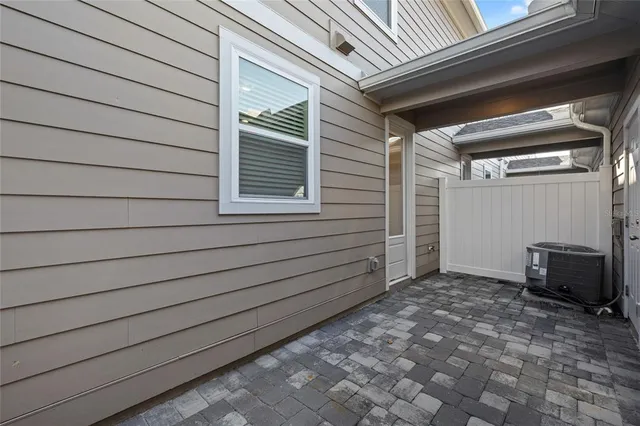 a view of a house with a door and wooden walls