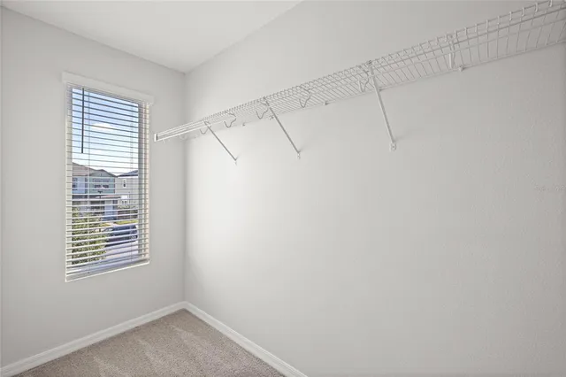 a view of a room that has a window in it