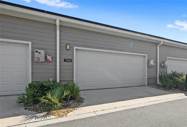 a front view of a house with a garage