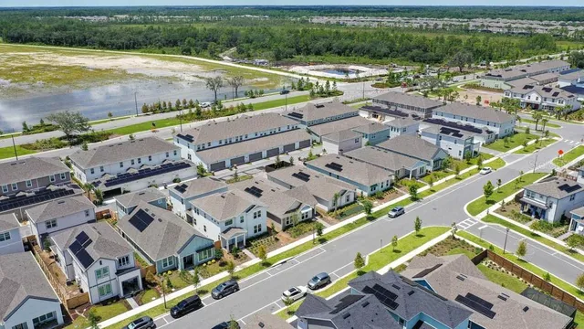 an aerial view of a city with a lake view