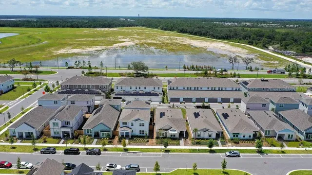 an aerial view of residential building and parking space