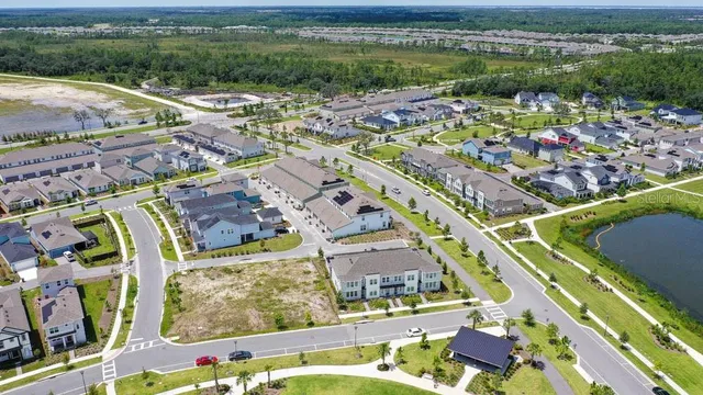 an aerial view of residential houses with outdoor space