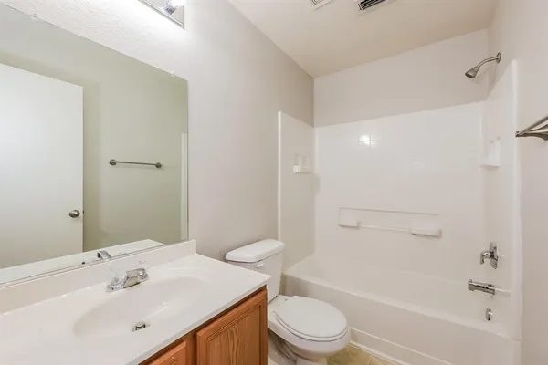 a view of a house with a yard and table