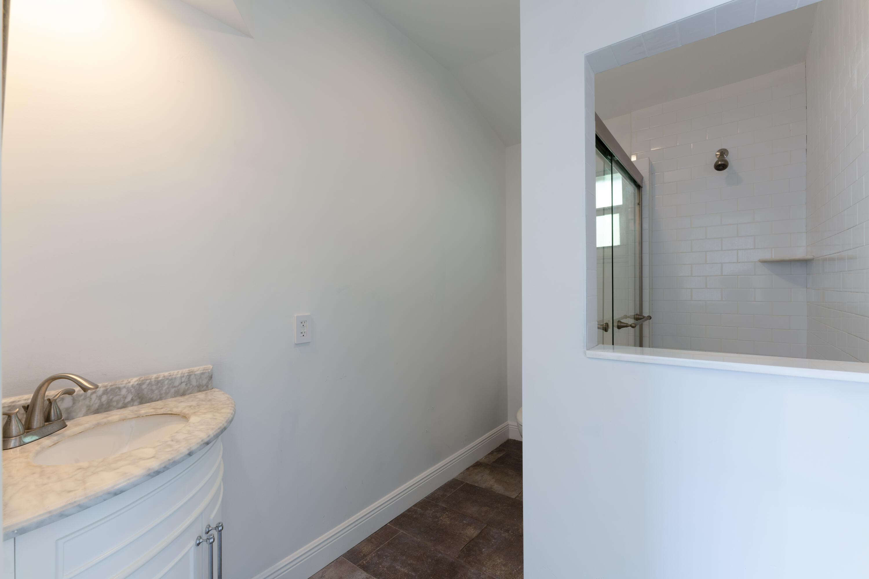 13757 Cocoanut Avenue Juno Beach, FL 33408 - Photo 22 of 31 a bathroom with a granite countertop sink and a mirror