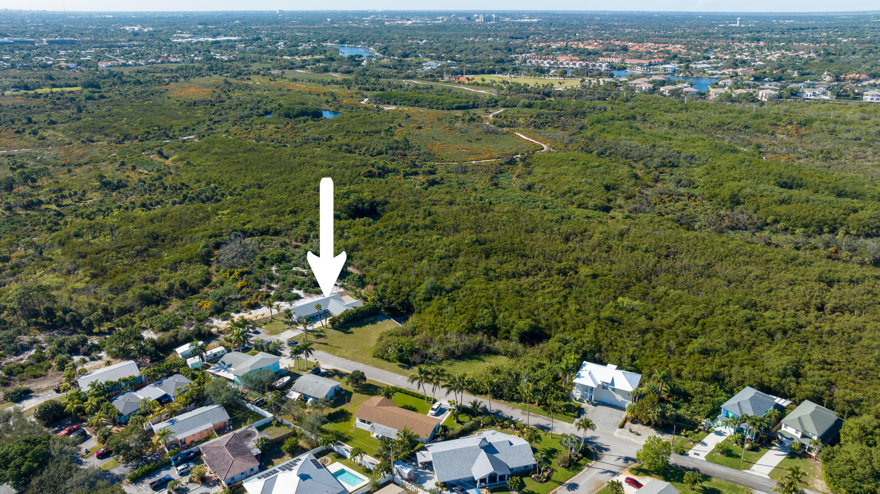 13757 Cocoanut Avenue Juno Beach, FL 33408 - Photo 29 of 31 an aerial view of residential houses with outdoor space and trees