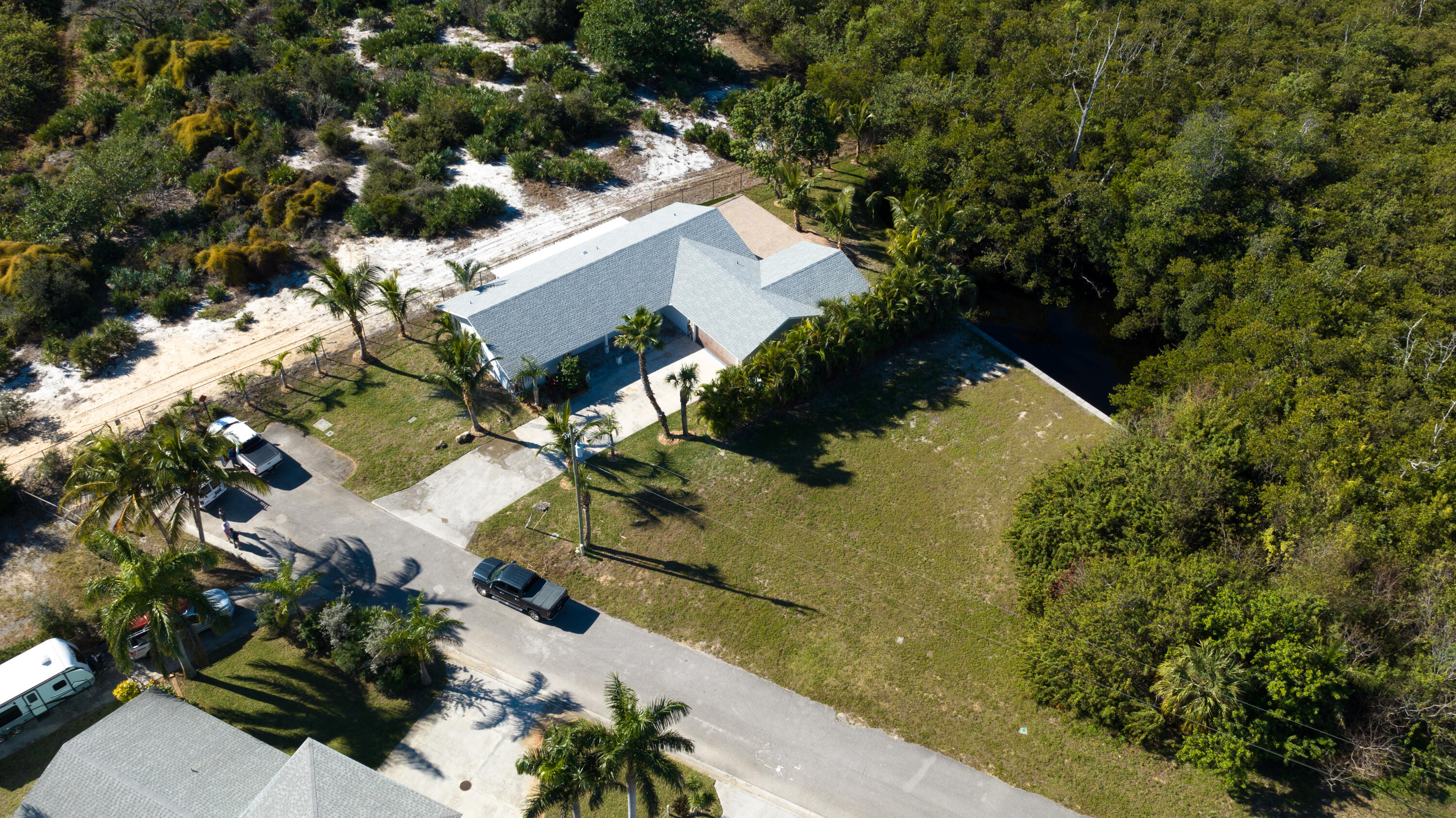 13757 Cocoanut Avenue Juno Beach, FL 33408 - Photo 3 of 31 an aerial view of residential house with outdoor space