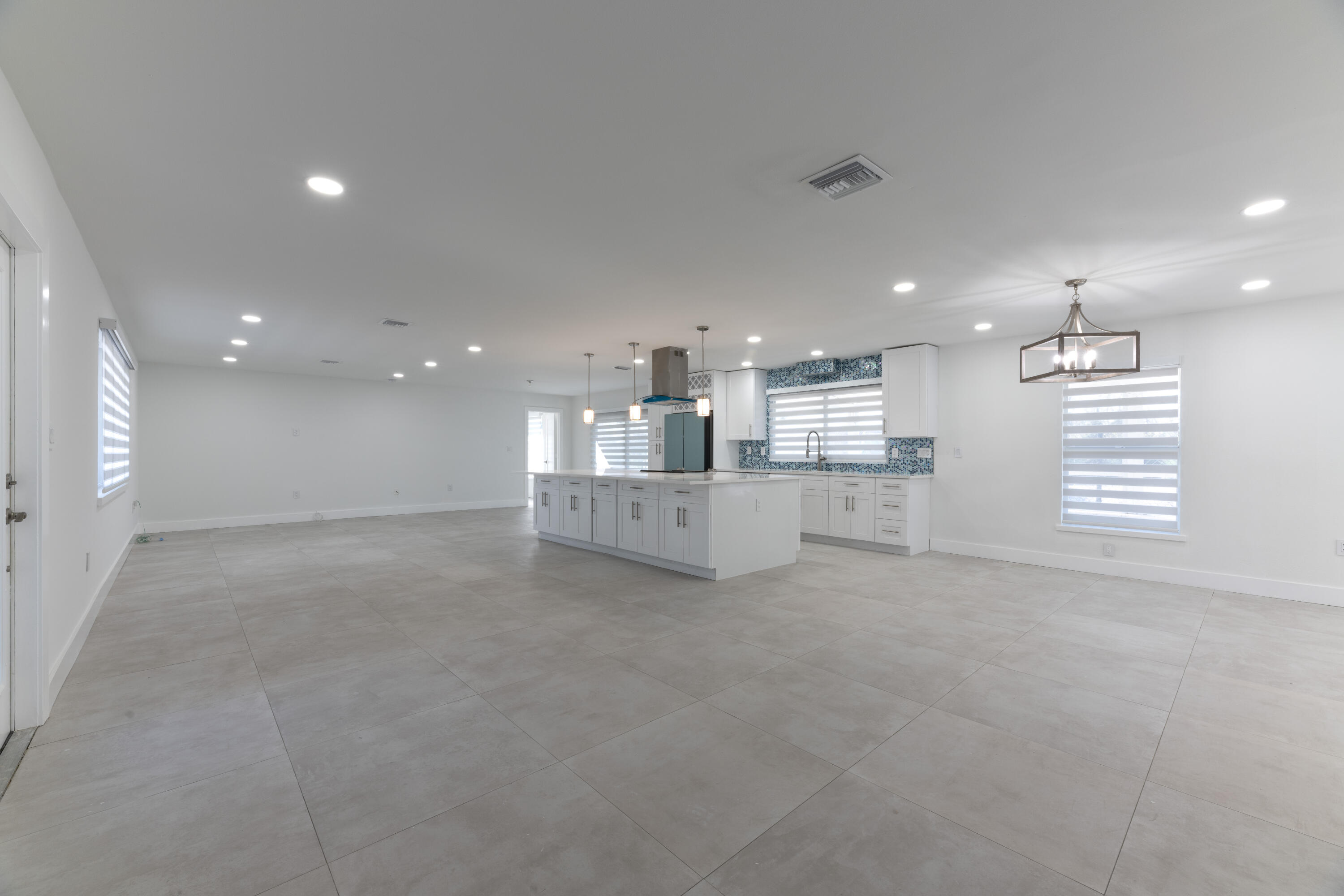 13757 Cocoanut Avenue Juno Beach, FL 33408 - Photo 8 of 31 a view of a kitchen with a sink and cabinets
