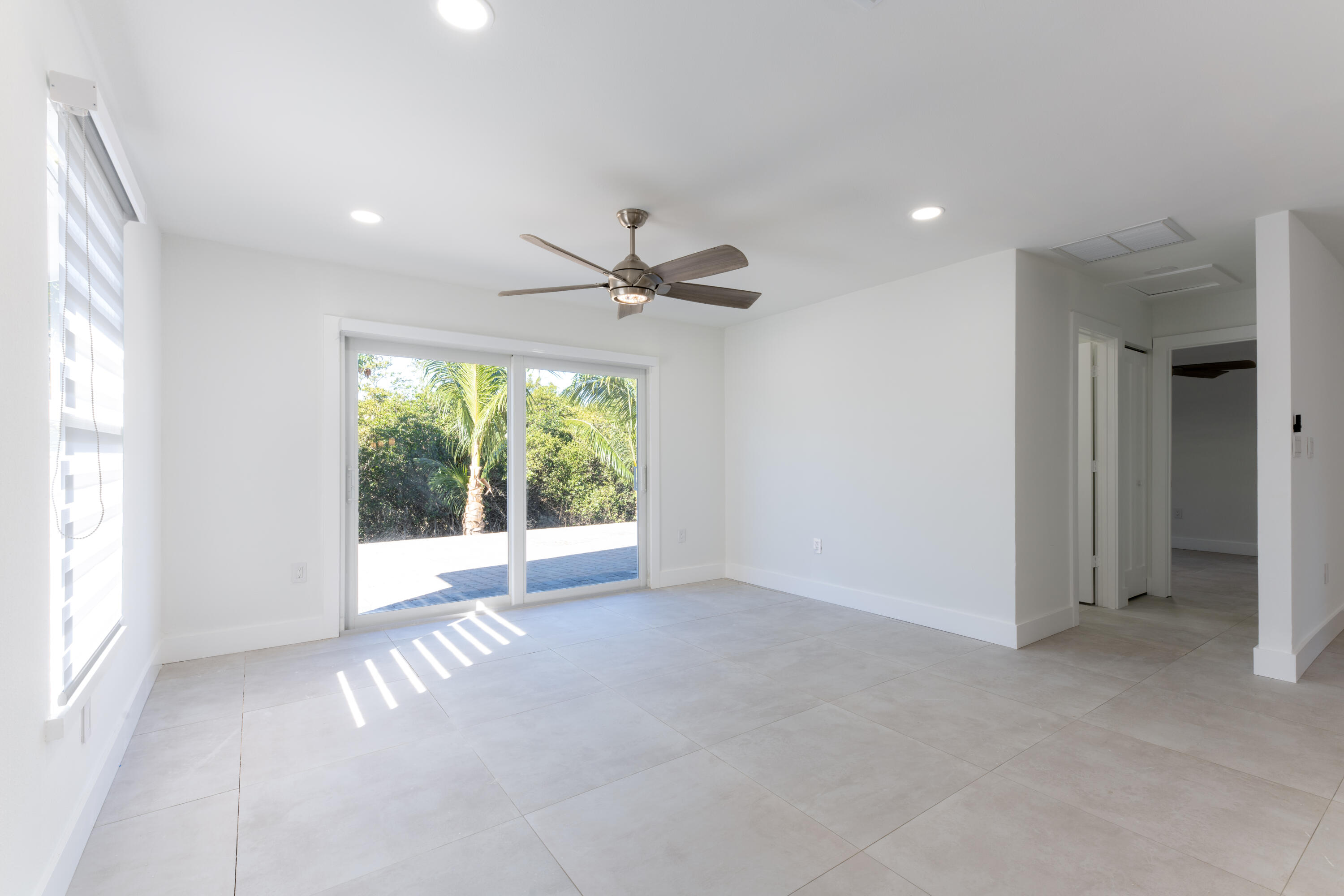 13757 Cocoanut Avenue Juno Beach, FL 33408 - Photo 9 of 31 a view of an empty room with a window