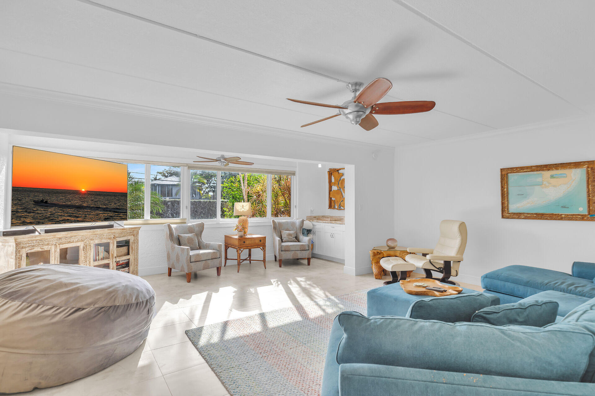 591 Sombrero Beach Road, Unit 8B Marathon, FL 33050 - Photo 16 of 43 a living room with furniture large window and a flat screen tv