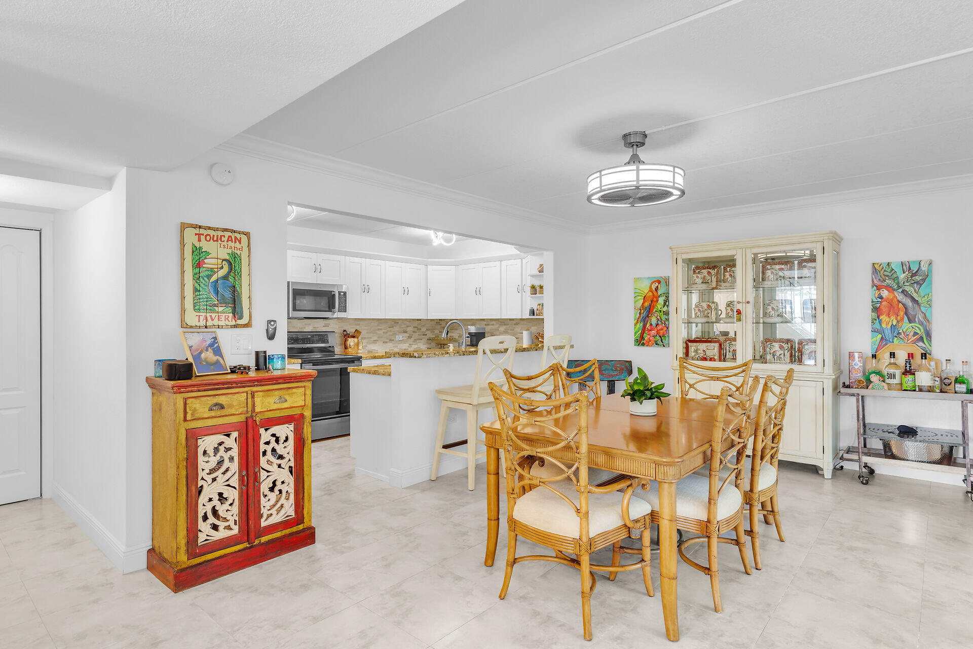 591 Sombrero Beach Road, Unit 8B Marathon, FL 33050 - Photo 19 of 43 a view of a dining room with furniture and wooden floor