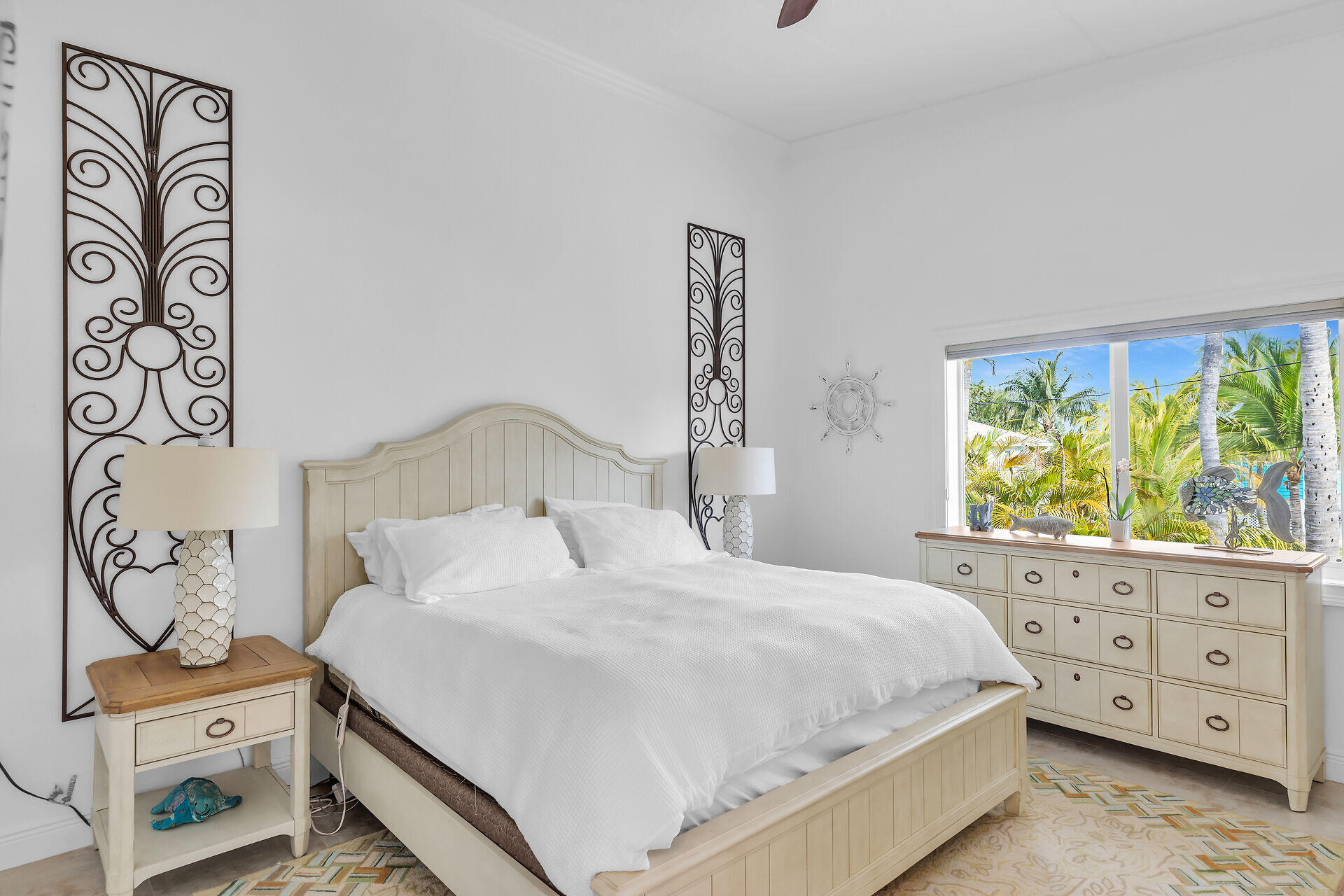 591 Sombrero Beach Road, Unit 8B Marathon, FL 33050 - Photo 21 of 43 a bedroom with a bed and a window