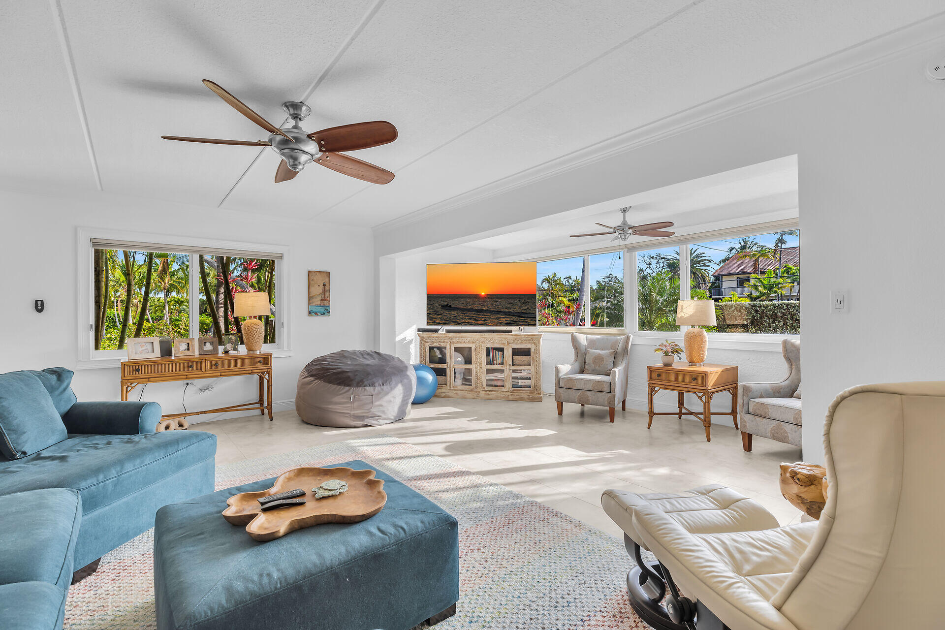 591 Sombrero Beach Road, Unit 8B Marathon, FL 33050 - Photo 21 of 43 a living room with furniture a flat screen tv and a large window