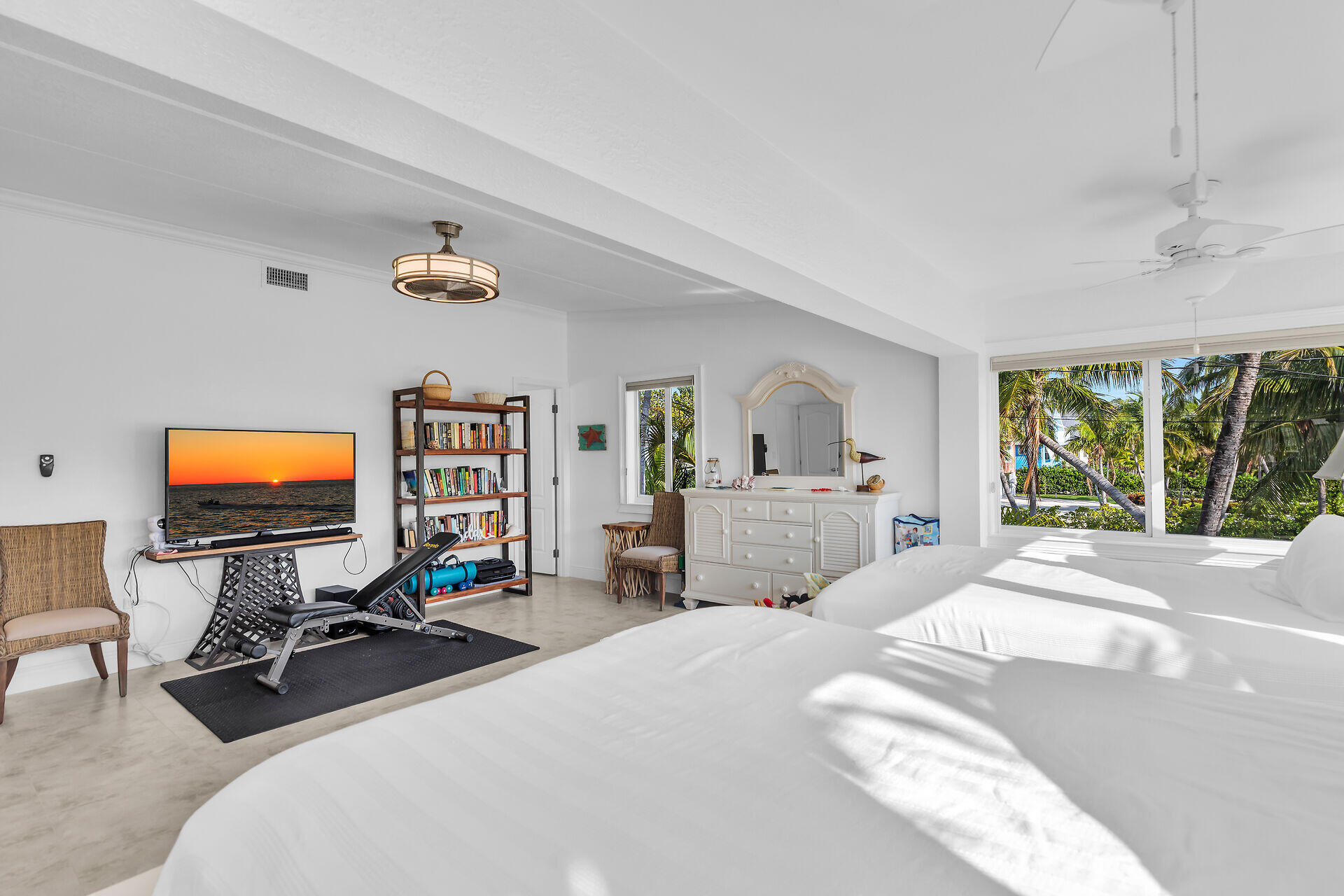 591 Sombrero Beach Road, Unit 8B Marathon, FL 33050 - Photo 25 of 43 a bedroom with a bed and a flat screen tv