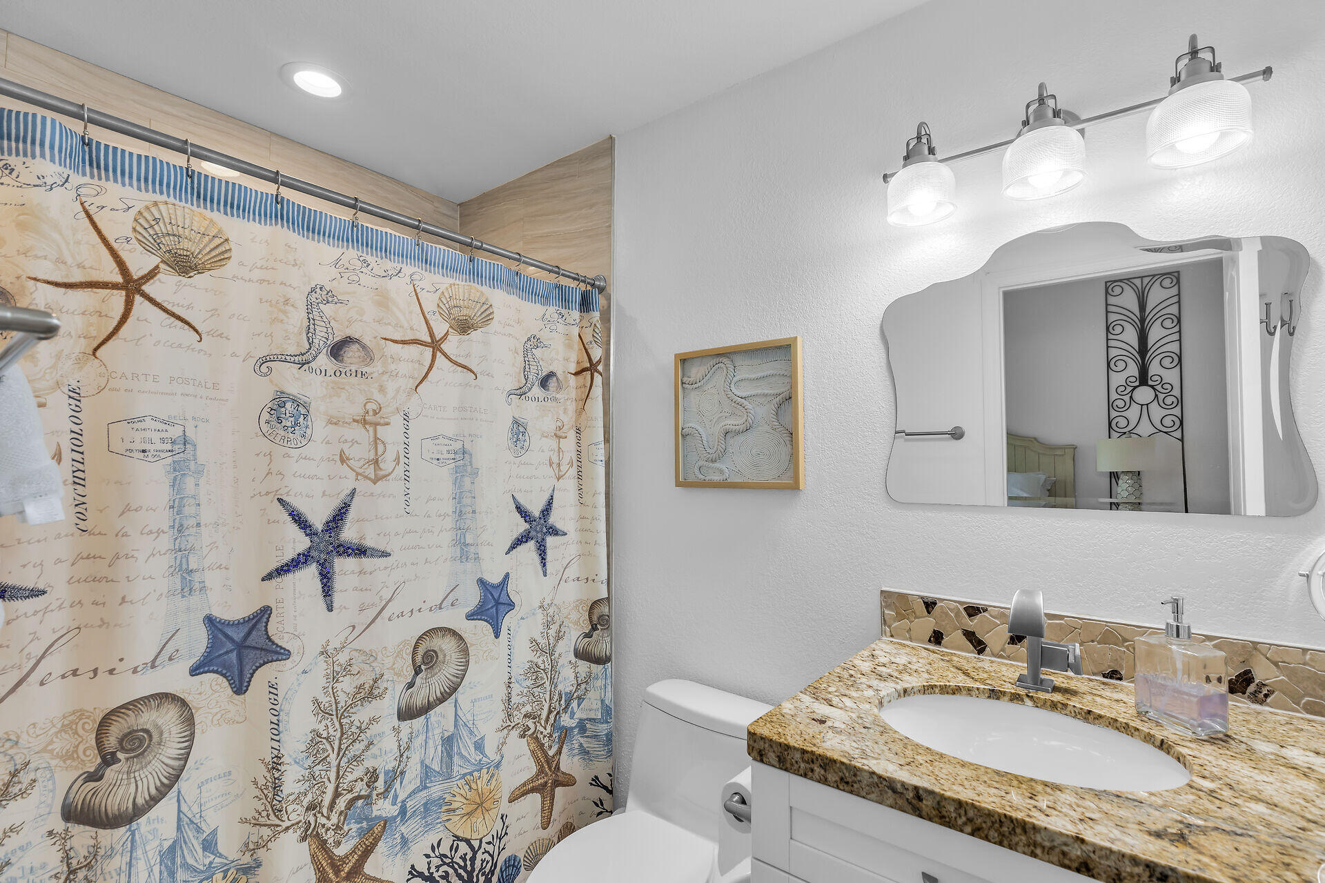 591 Sombrero Beach Road, Unit 8B Marathon, FL 33050 - Photo 29 of 43 a bathroom with a granite countertop sink a toilet and shower