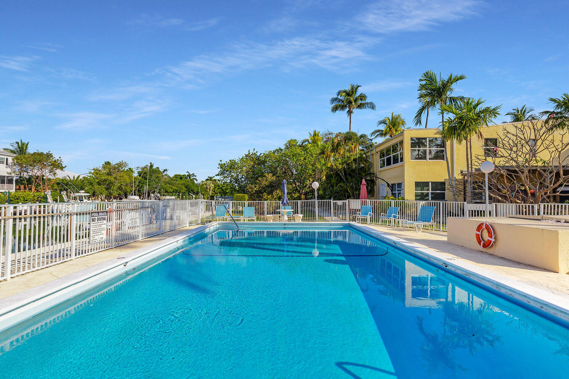 591 Sombrero Beach Road, Unit 8B Marathon, FL 33050 - Photo 34 of 43 a view of a house with a swimming pool