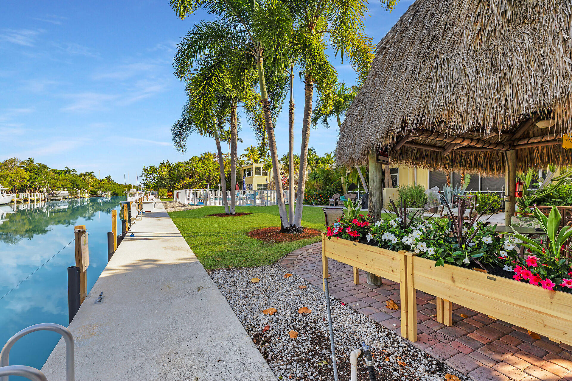591 Sombrero Beach Road, Unit 8B Marathon, FL 33050 - Photo 38 of 43 a view of a park with plants and a bench