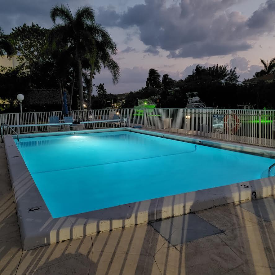 591 Sombrero Beach Road, Unit 8B Marathon, FL 33050 - Photo 38 of 43 Pool lit at dusk