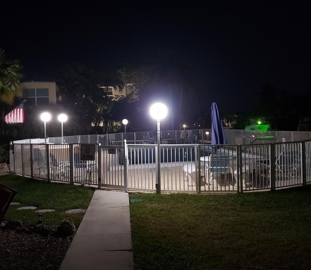 591 Sombrero Beach Road, Unit 8B Marathon, FL 33050 - Photo 39 of 43 a view of a yard with wooden fence