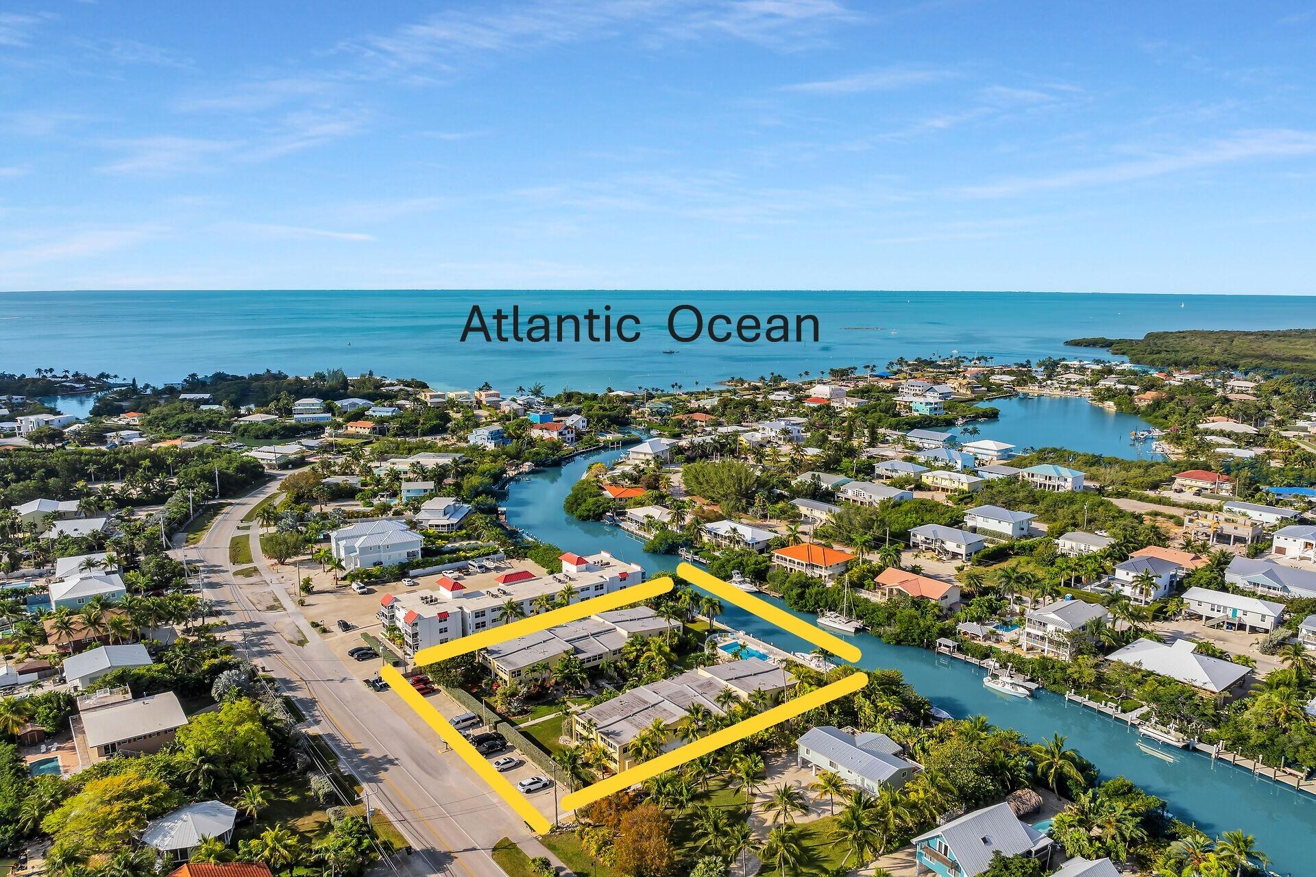 591 Sombrero Beach Road, Unit 8B Marathon, FL 33050 - Photo 4 of 43 an aerial view of residential building and ocean